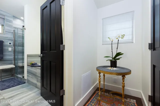 a view of a bathroom with a sink and a mirror