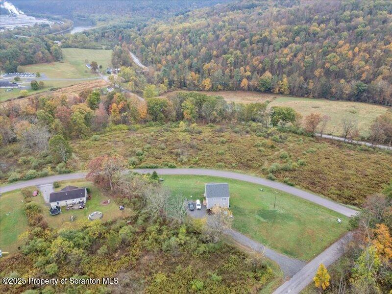 Lot 16 Walnut Rdg Drive Mehoopany, PA 18629 - Photo 2 of 4 a view of a lake from a yard