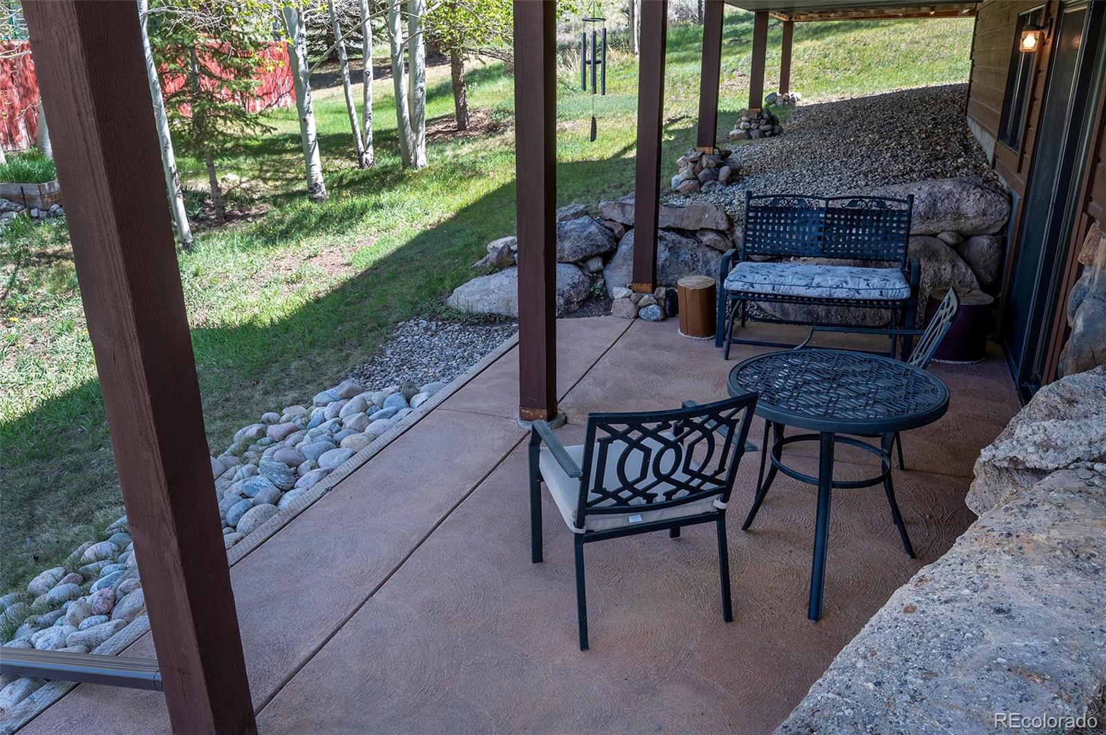 290 Village Road Granby, CO 80446 - Photo 33 of 45 a view of a porch with chairs and backyard