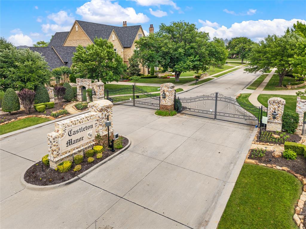 6900 Rockingham Court Colleyville, TX 76034 - Photo 2 of 40 Private, Gated, Stone column entry featuring a wrought iron gate and keypad entry station