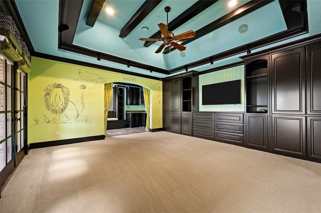 6900 Rockingham Court Colleyville, TX 76034 - Photo 22 of 40 PlayRoom/Game Room is versatile. Has its own walk-out balcony with double doors, en-suite 1/2 bathroom, and wet bar