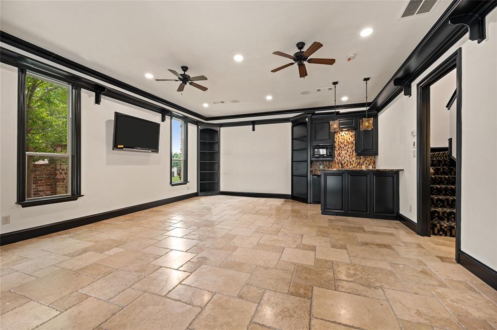 6900 Rockingham Court Colleyville, TX 76034 - Photo 29 of 40 1st Floor of Guest House ADU features a covered patio, kitchen with bar, ensuite bathroom, ceiling fans and utility closet. Can be used for extended stay guests, entertaining, nanny, or live-in quarters