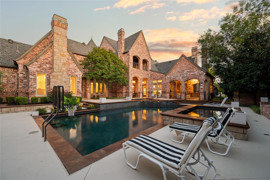 6900 Rockingham Court Colleyville, TX 76034 - Photo 36 of 40 Expansive brick and stone exterior with multiple gables