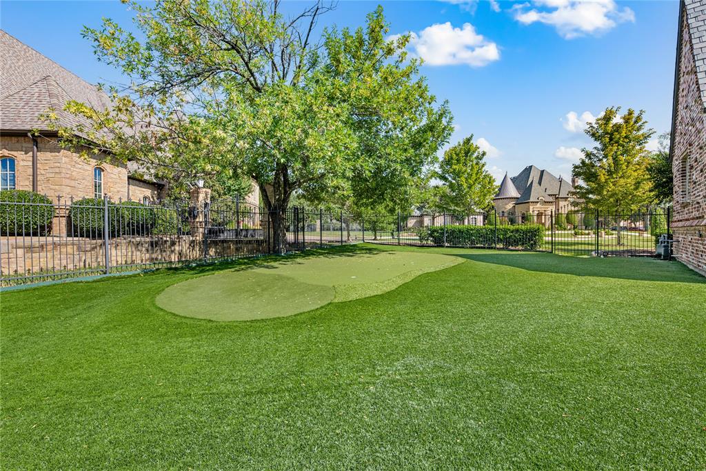 6900 Rockingham Court Colleyville, TX 76034 - Photo 38 of 40 Expansive turfed side yard featuring a putting green