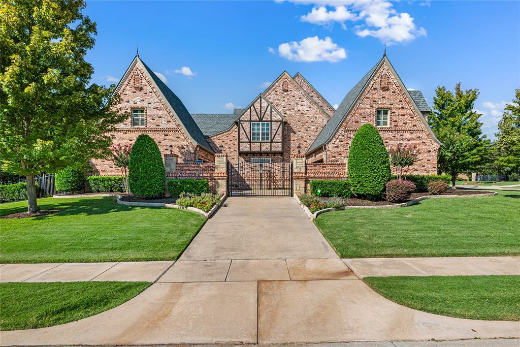 6900 Rockingham Court Colleyville, TX 76034 - Photo 39 of 40 Side Entry, Gated, Motor Court/Driveway has 2 opposing oversized garages with a workshop. Each garage holds 2 cars for a total of 4 cars, trucks, or SUV's