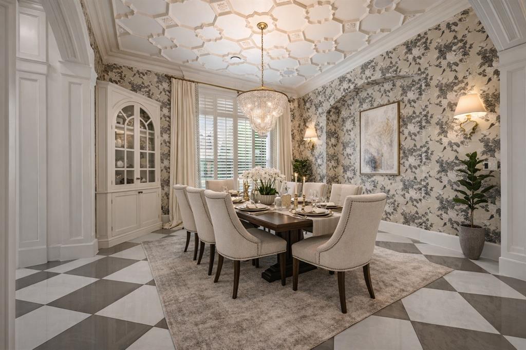 6900 Rockingham Court Colleyville, TX 76034 - Photo 8 of 40 Dining space featuring Harlequin patterned wallpaper, coffered ceiling, built-in hutch, and crystal chandelier