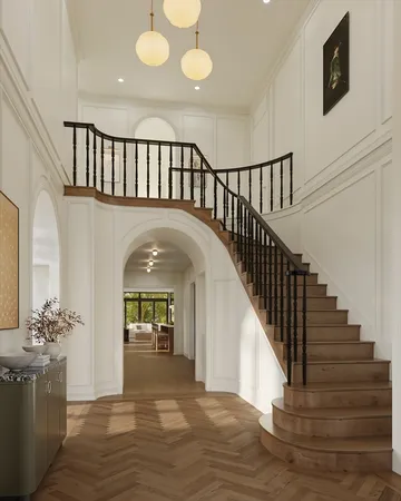 a view of entryway and hall with wooden floor