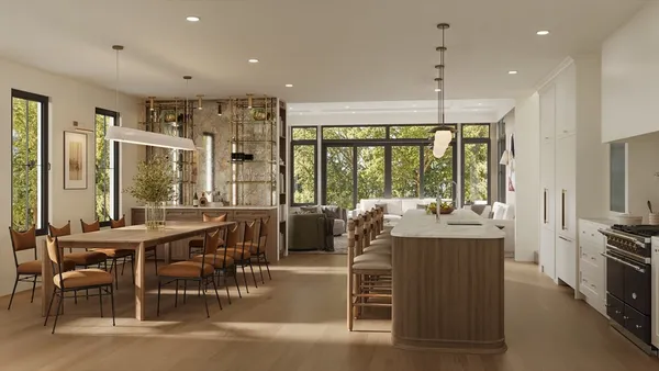 a living room with furniture large windows and a chandelier