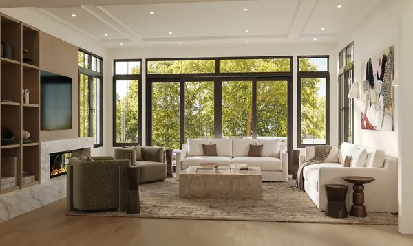 a living room with furniture and large windows