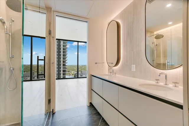 a bathroom with a double vanity sink mirror and double