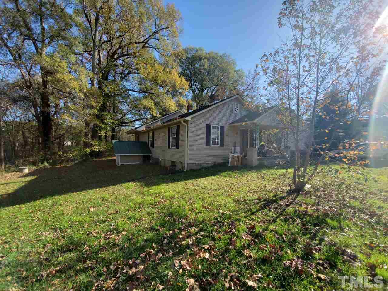 97 Allie Clay Road Roxboro, NC 27573 - Photo 5 of 20 a view of backyard of house with green space