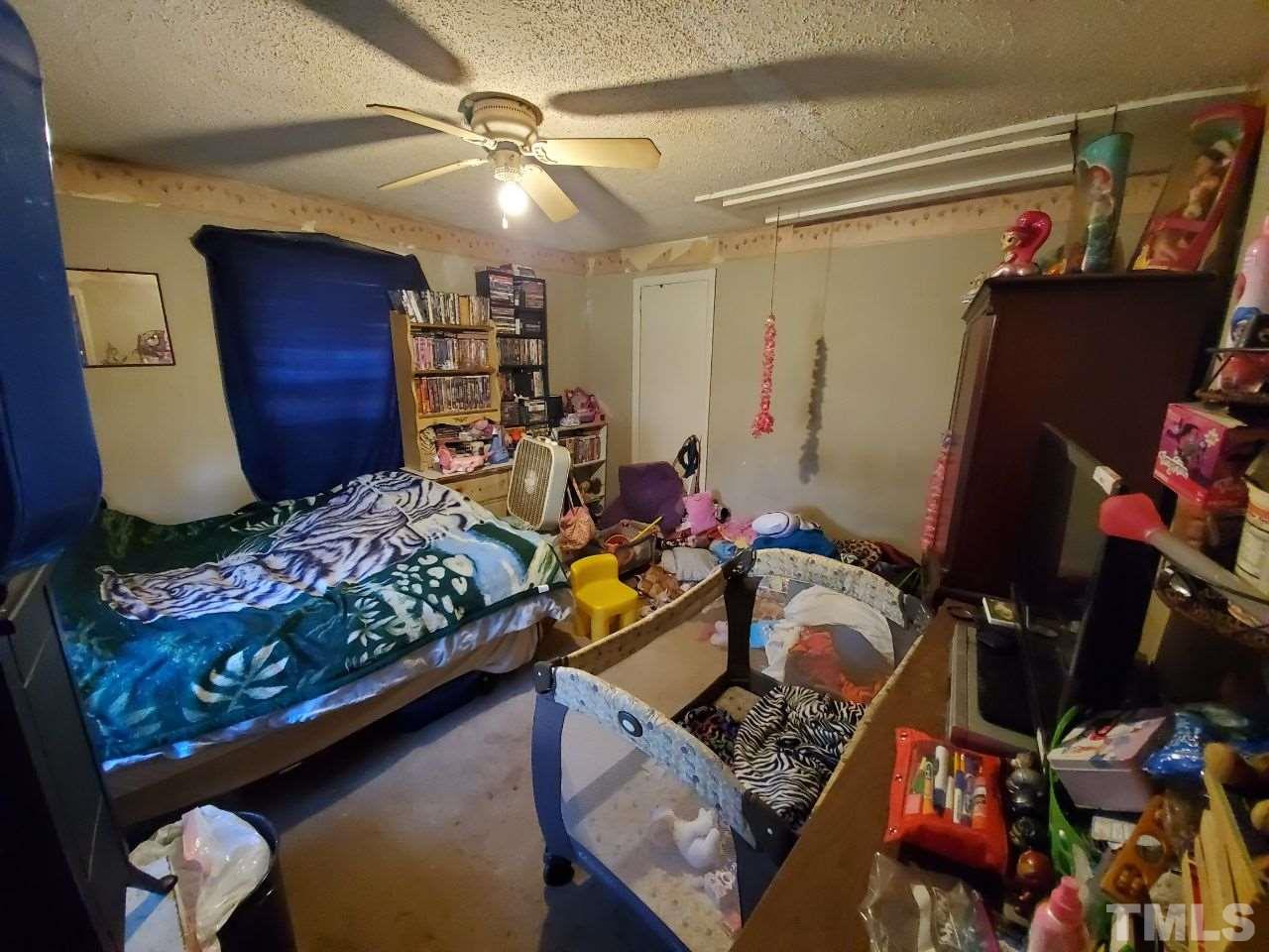 97 Allie Clay Road Roxboro, NC 27573 - Photo 8 of 20 a view of gym equipment and children play room