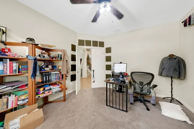 a view of a workspace with furniture