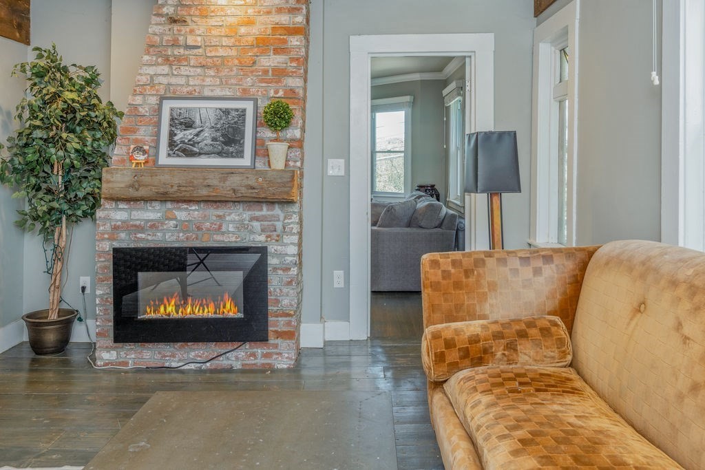 28 Village Street, Unit 2 Marblehead, MA 01945 - Photo 12 of 16 a living room with furniture and a fireplace