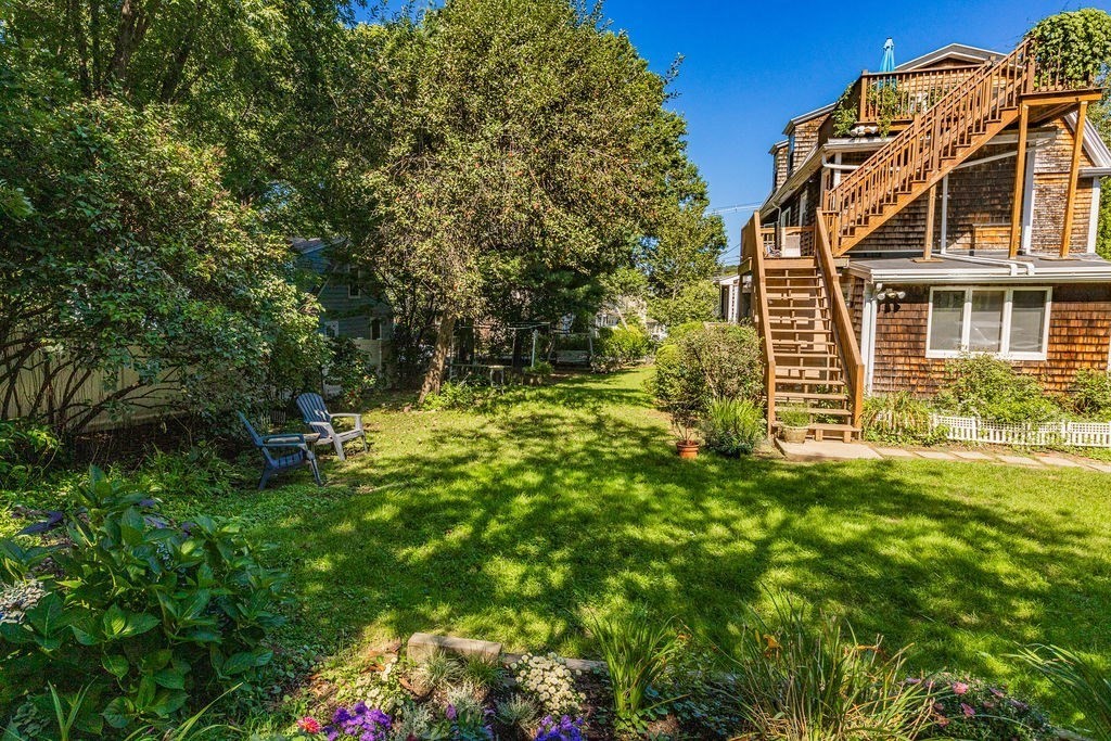 28 Village Street, Unit 2 Marblehead, MA 01945 - Photo 15 of 16 a view of a big yard with plants and large trees