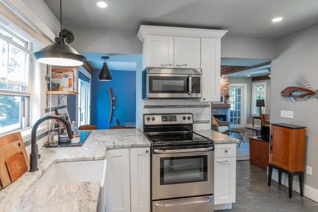 28 Village Street, Unit 2 Marblehead, MA 01945 - Photo 4 of 16 a kitchen with a sink appliances and cabinets
