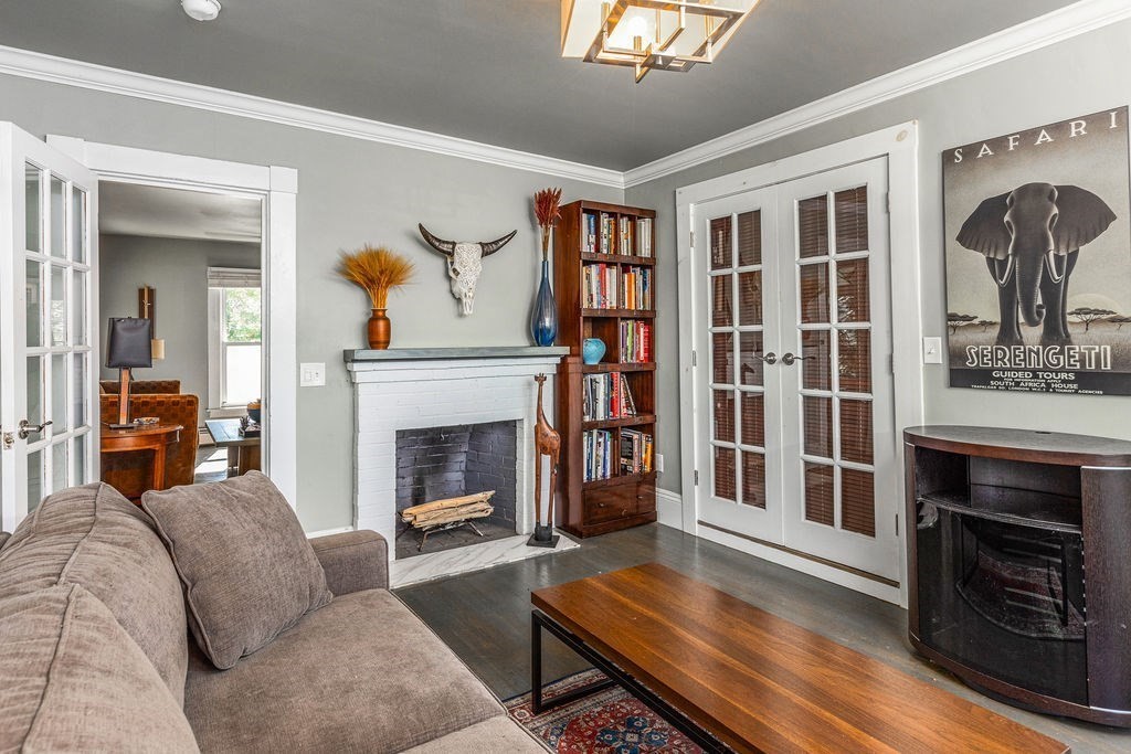 28 Village Street, Unit 2 Marblehead, MA 01945 - Photo 8 of 16 a living room with furniture fireplace and wooden floor