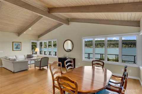 a work room with furniture and a large window