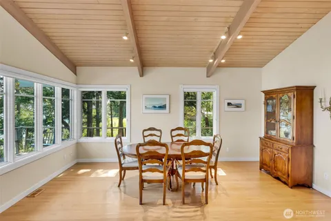 a view of a dining room with furniture window and outside view