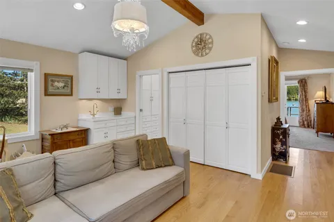 a living room with furniture and a chandelier