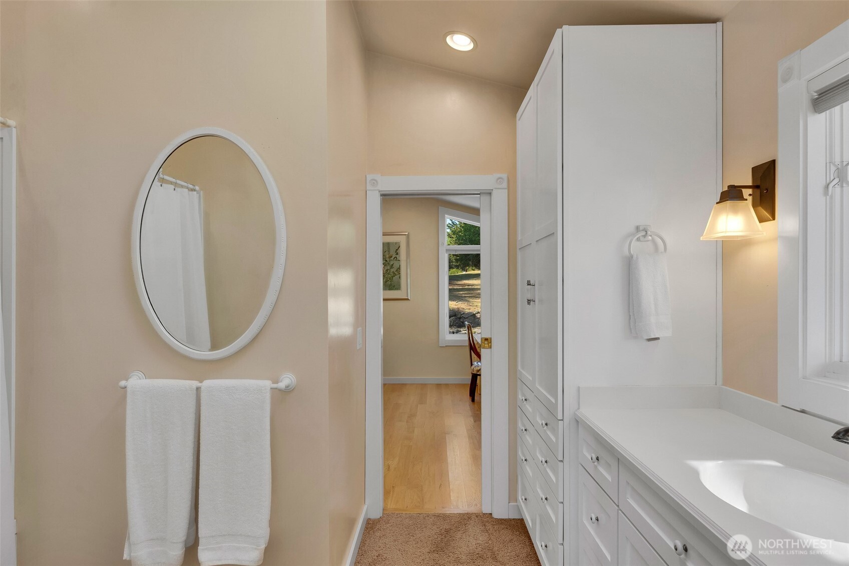 1794 Bayshore Road Lopez Island, WA 98261 - Photo 28 of 39 a bathroom with a sink a mirror and a shower