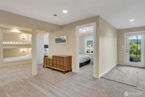 a spacious bedroom with a bed and a view of outdoor space