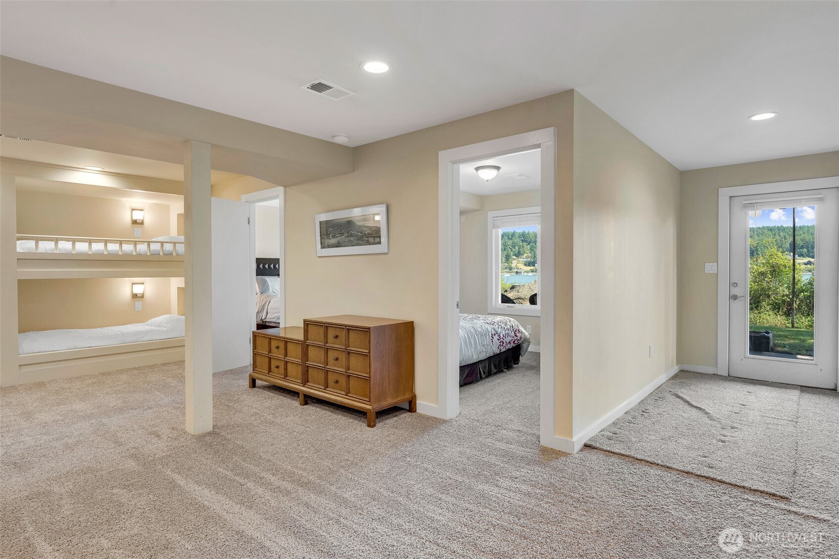 1794 Bayshore Road Lopez Island, WA 98261 - Photo 29 of 39 a spacious bedroom with a bed and a view of outdoor space