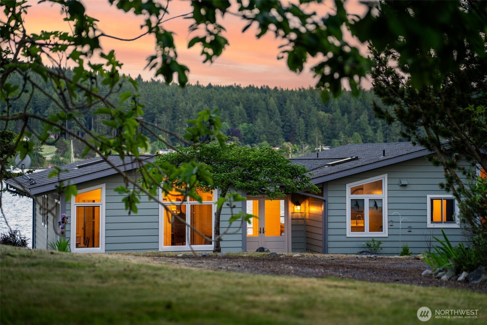 1794 Bayshore Road Lopez Island, WA 98261 - Photo 5 of 39 a front view of a house with a yard