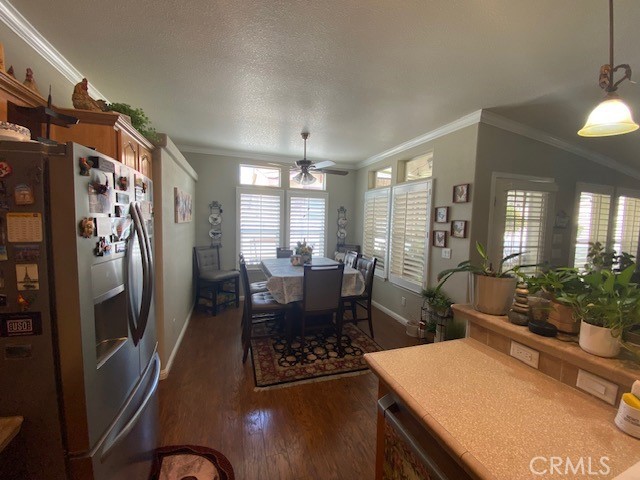 1051 Site Drive, Unit 281 Brea, CA 92821 - Photo 11 of 42 a view of a dining room with furniture and a chandelier