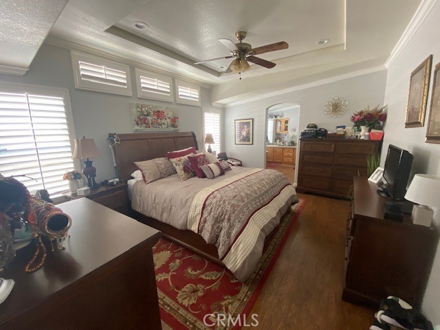 1051 Site Drive, Unit 281 Brea, CA 92821 - Photo 16 of 42 a bedroom with a large bed a flat tv screen and a dresser