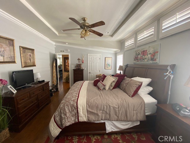 1051 Site Drive, Unit 281 Brea, CA 92821 - Photo 18 of 42 a bedroom with a bed and glass walk in closet