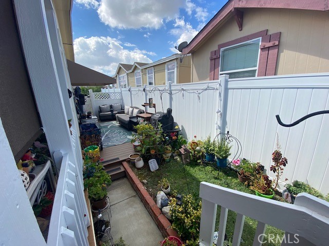 1051 Site Drive, Unit 281 Brea, CA 92821 - Photo 29 of 42 a backyard of a house with wooden floor barbeque oven and plants