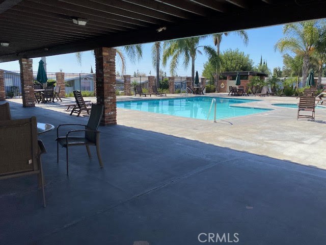 1051 Site Drive, Unit 281 Brea, CA 92821 - Photo 36 of 42 a view of a swimming pool with a patio