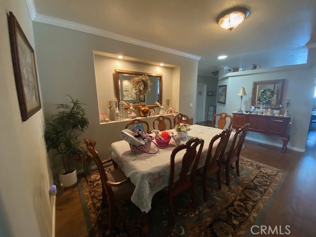 1051 Site Drive, Unit 281 Brea, CA 92821 - Photo 6 of 42 a view of a dining room with furniture and wooden floor