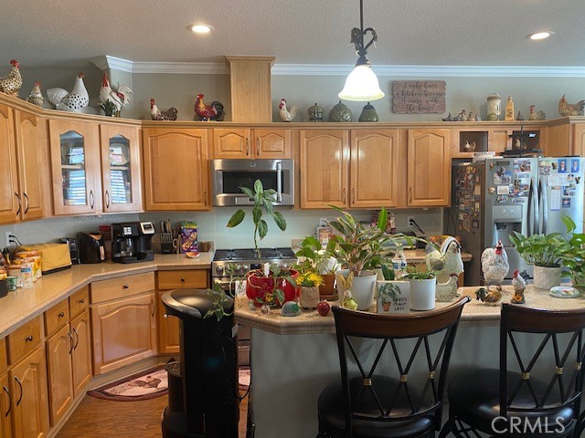 1051 Site Drive, Unit 281 Brea, CA 92821 - Photo 8 of 42 a kitchen with stainless steel appliances granite countertop a sink a stove and a wooden floors