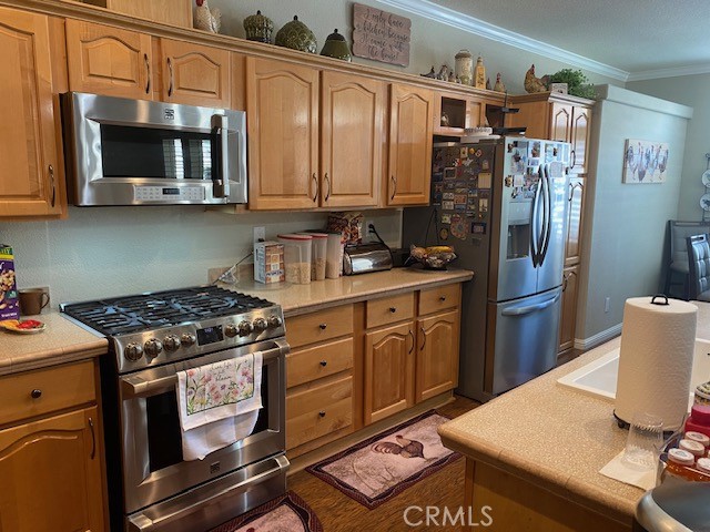 1051 Site Drive, Unit 281 Brea, CA 92821 - Photo 10 of 42 a kitchen with stainless steel appliances granite countertop a stove refrigerator and a microwave