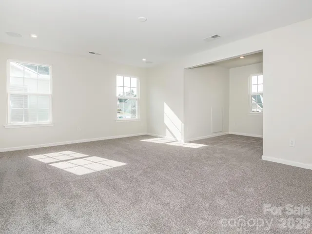 a bathroom with a window and a shower