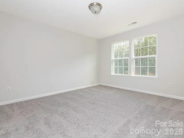 a bathroom with a double vanity sink toilet and a bathtub