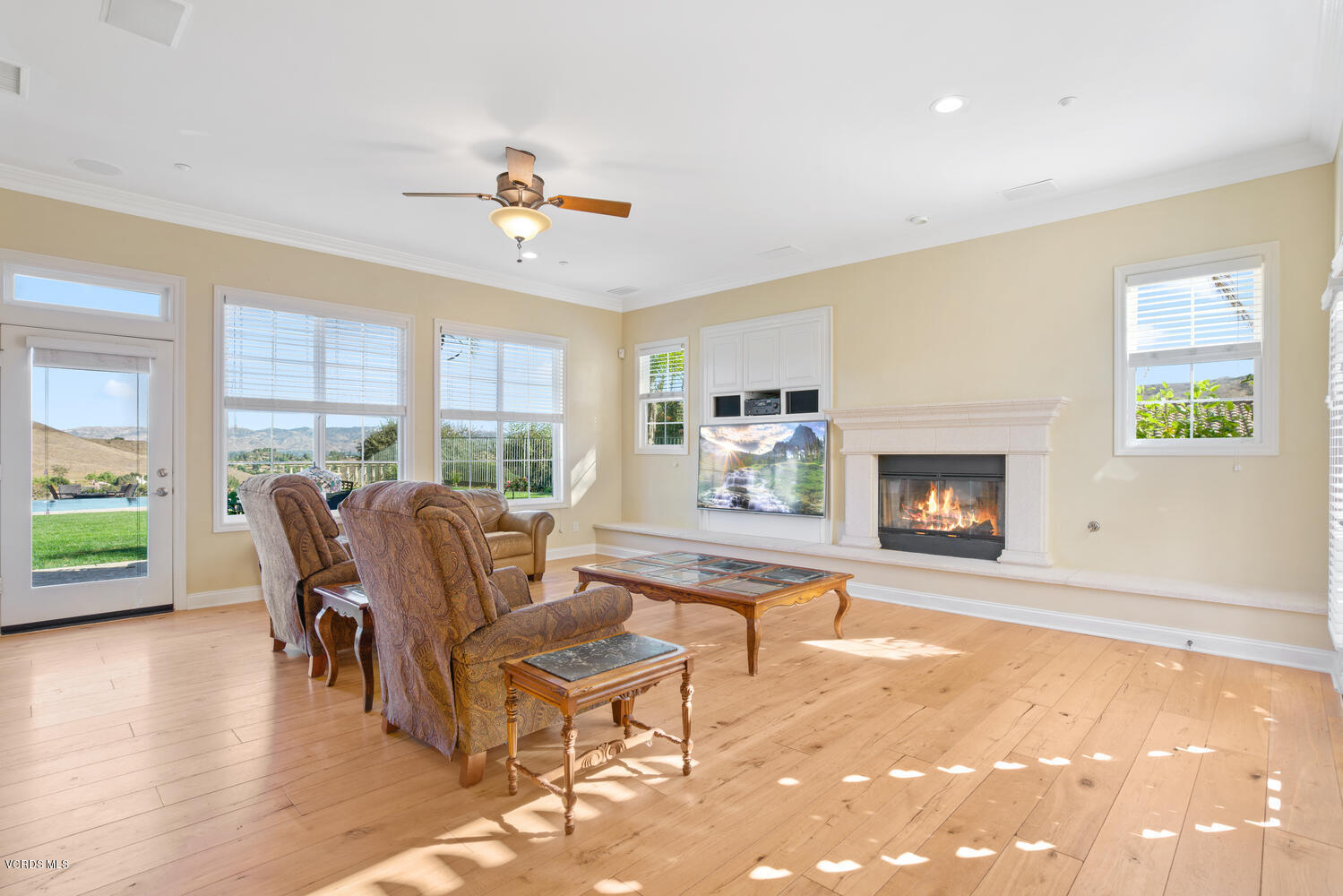 477 Vineyard Drive Simi Valley, CA 93065 - Photo 18 of 65 a living room with fireplace furniture and a floor to ceiling window