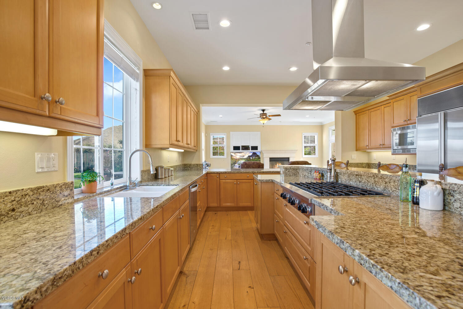 477 Vineyard Drive Simi Valley, CA 93065 - Photo 23 of 65 a large kitchen with stainless steel appliances granite countertop lots of counter top and a stove