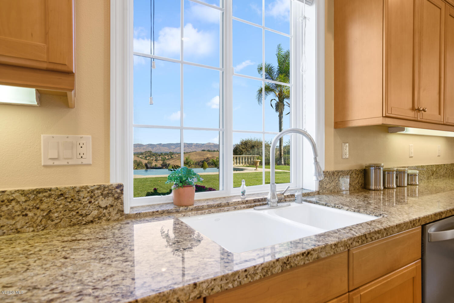 477 Vineyard Drive Simi Valley, CA 93065 - Photo 24 of 65 a kitchen with granite countertop a sink and a window