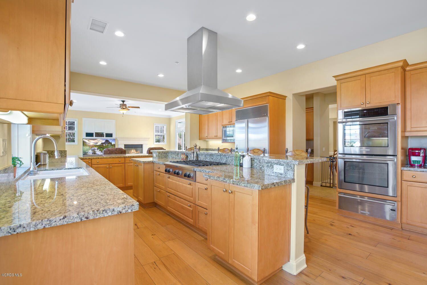 477 Vineyard Drive Simi Valley, CA 93065 - Photo 25 of 65 a kitchen with counter top space cabinets and stainless steel appliances