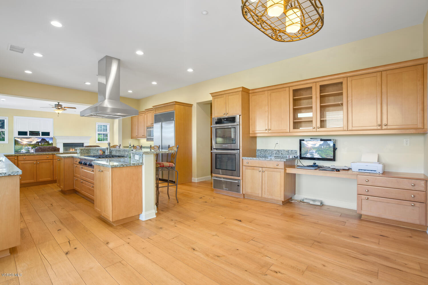 477 Vineyard Drive Simi Valley, CA 93065 - Photo 27 of 65 a kitchen with stainless steel appliances kitchen island granite countertop a stove and cabinets