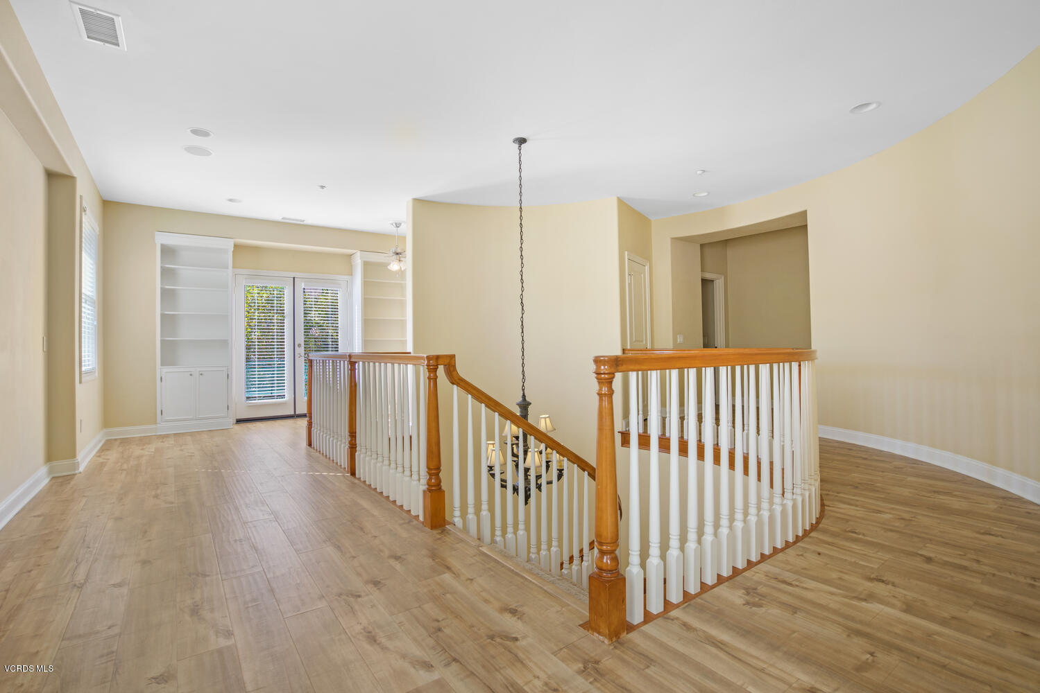 477 Vineyard Drive Simi Valley, CA 93065 - Photo 36 of 65 a view of a hallway with wooden floor and windows