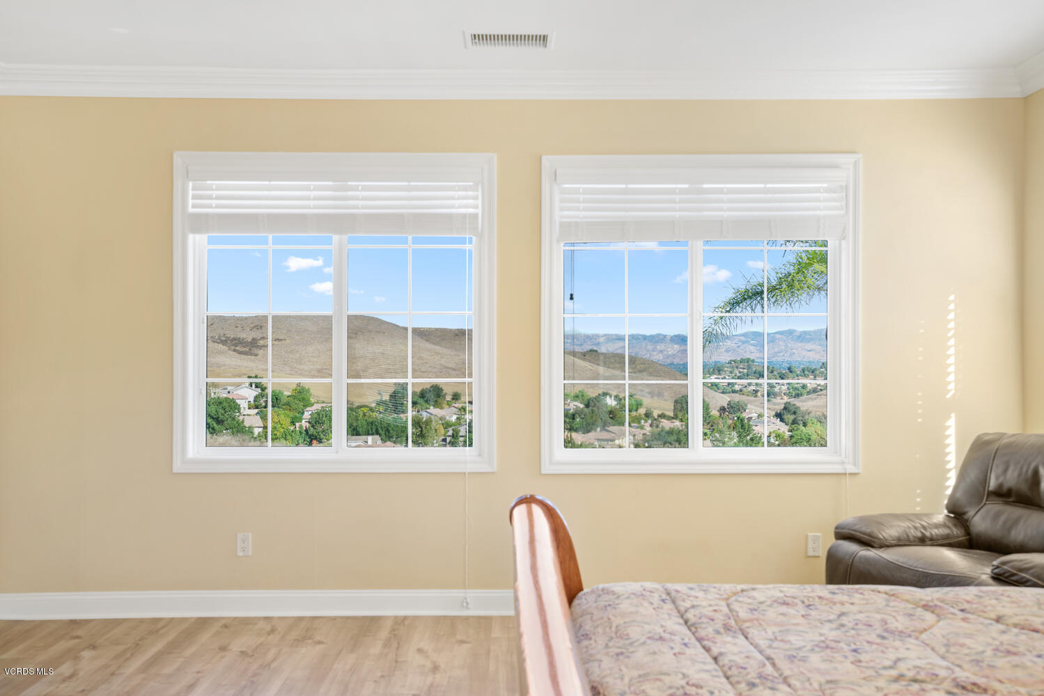 477 Vineyard Drive Simi Valley, CA 93065 - Photo 39 of 65 a bedroom with a bed and wooden floor