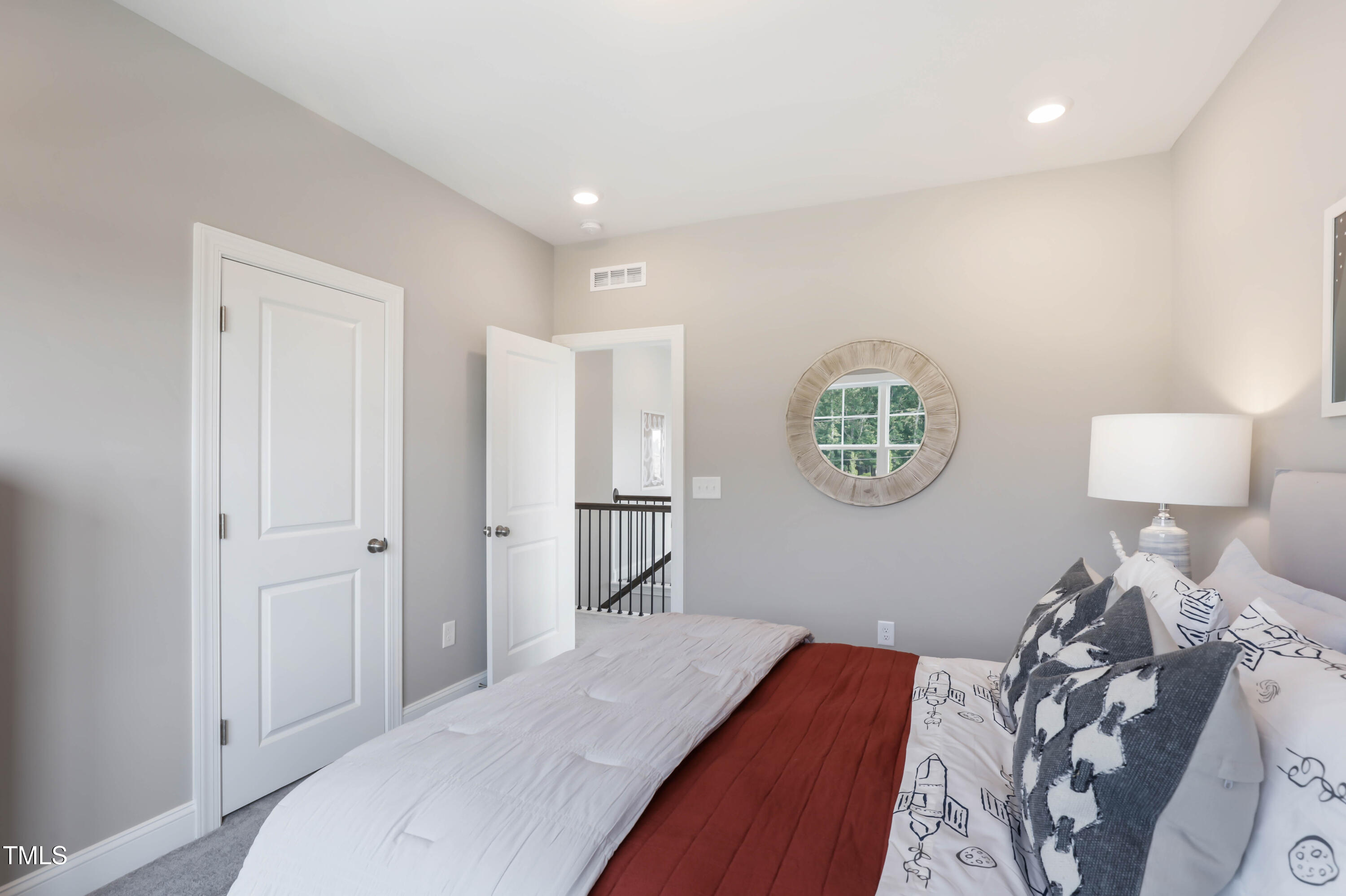 909 Jasper Mine Trail Raleigh, NC 27610 - Photo 25 of 39 a bedroom with bed and a window