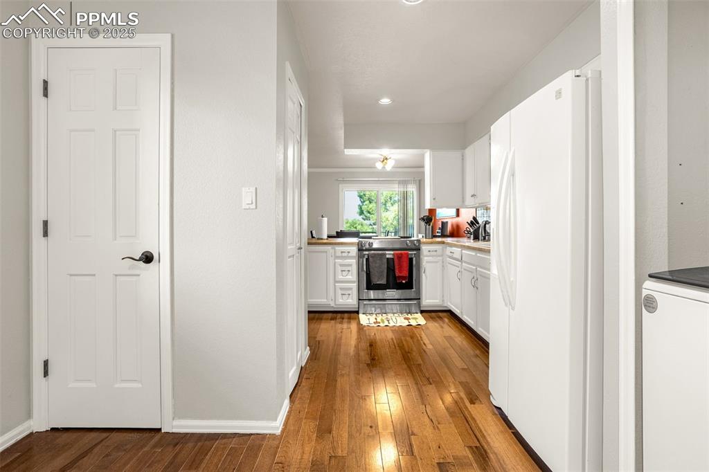 342 Mission Hill Way Colorado Springs, CO 80921 - Photo 13 of 37 a kitchen with a sink and wooden floor