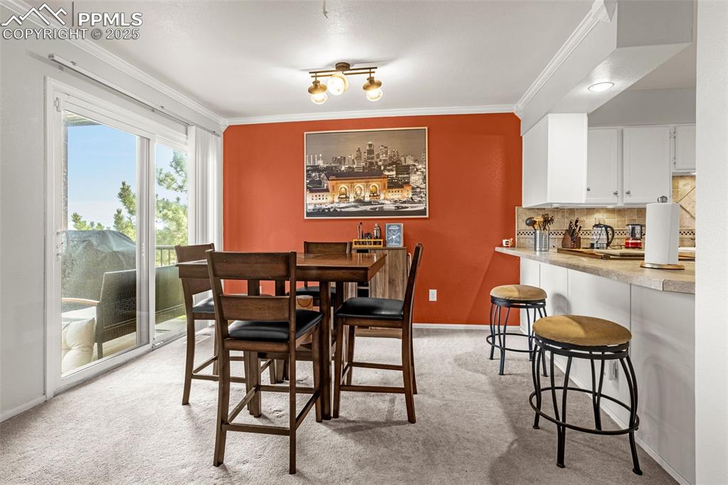 342 Mission Hill Way Colorado Springs, CO 80921 - Photo 18 of 37 a view of a dining room with furniture