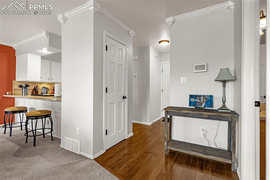 342 Mission Hill Way Colorado Springs, CO 80921 - Photo 19 of 37 a hallway with table and chairs