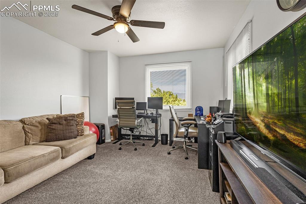 342 Mission Hill Way Colorado Springs, CO 80921 - Photo 24 of 37 a living room with furniture and a large window